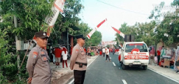 Polsek Ngawi Kota Amankan Jalan Sehat dalam Meriahkan HUT RI Ke 80
